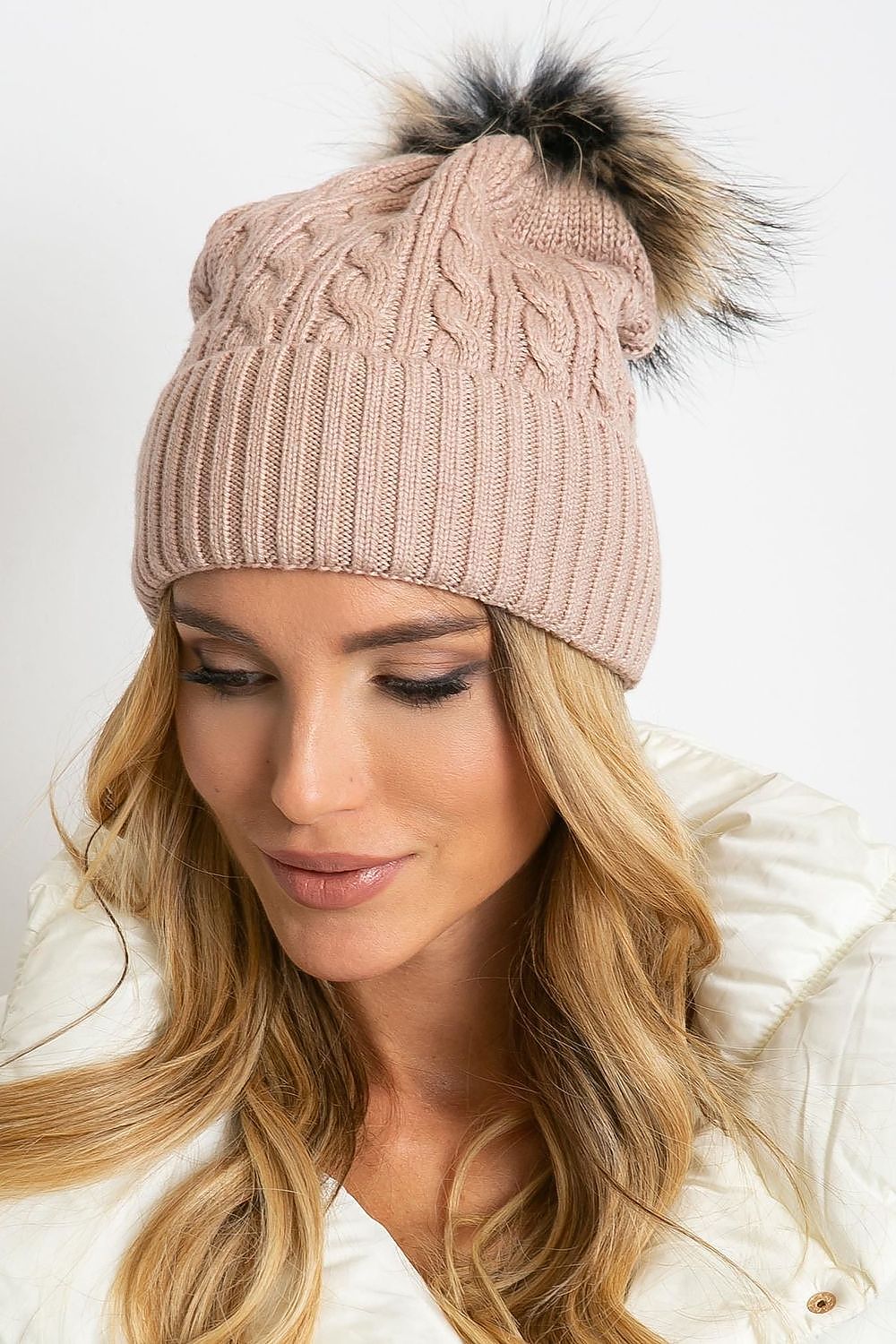 Luxurious winter cap by AT, designed with a wide cuff and fluffy pompom, crafted from a high-quality mix of 50% acrylic, 30% cotton, and 20% cashmere.