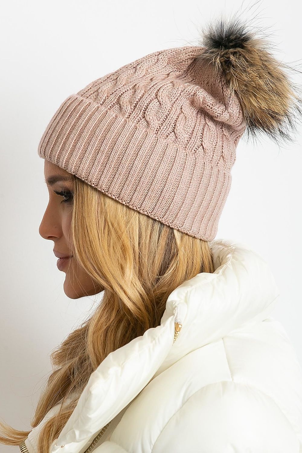 Luxury winter cap by AT featuring a wide cuff and fluffy pompom, crafted from a premium blend of 50% acrylic, 30% cotton, and 20% cashmere.