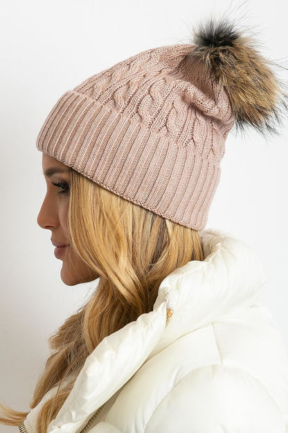 Luxury winter cap by AT featuring a wide cuff and fluffy pompom, crafted from a premium blend of 50% acrylic, 30% cotton, and 20% cashmere.