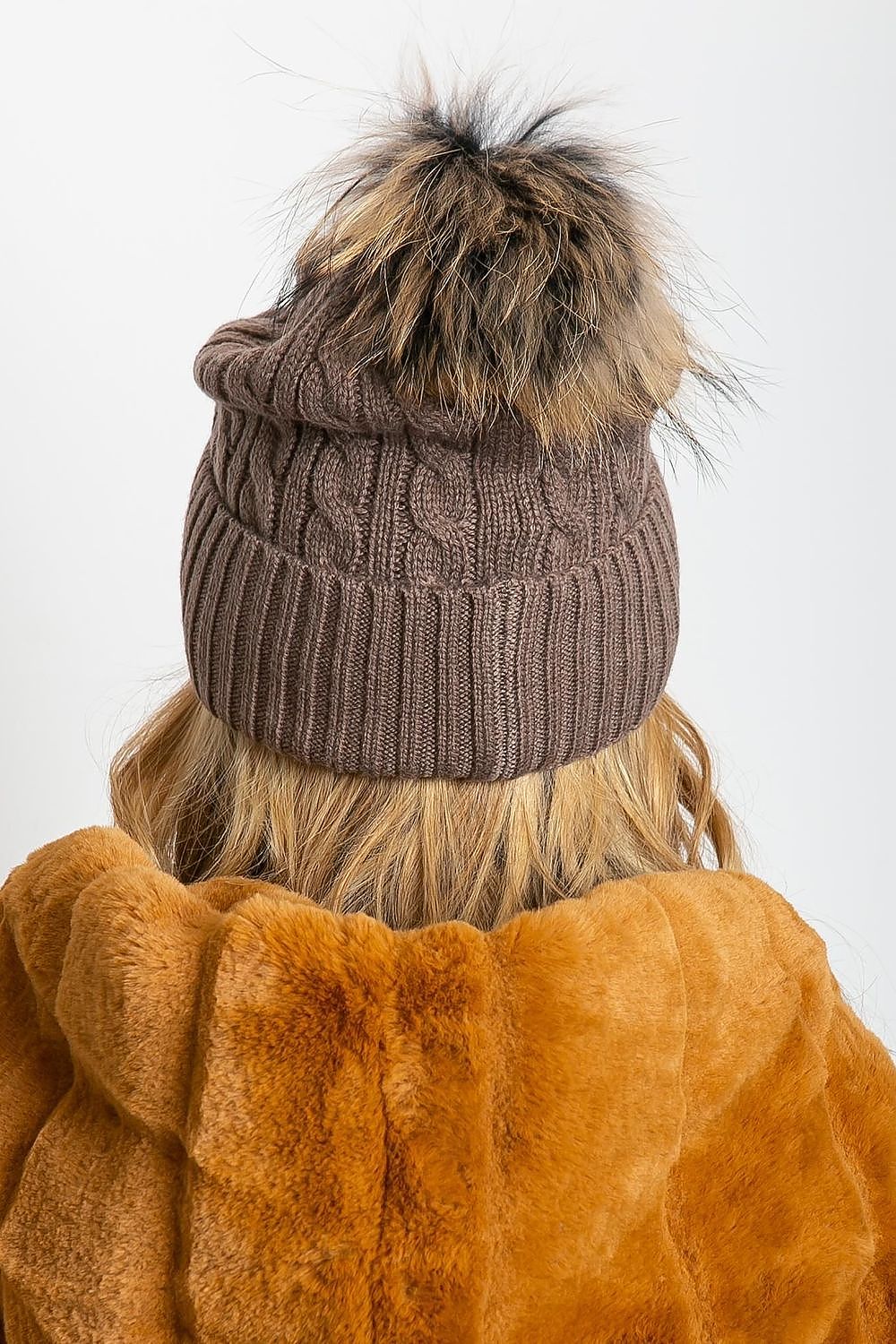 Sophisticated winter hat by AT, featuring a fashionable wide cuff and a fluffy pompom, designed with a premium mix of acrylic, cotton, and cashmere.
