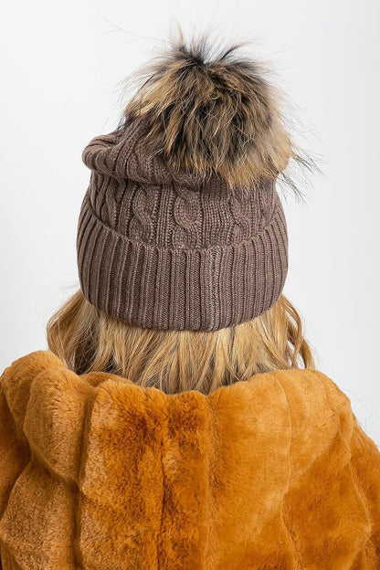 Sophisticated winter hat by AT, featuring a fashionable wide cuff and a fluffy pompom, designed with a premium mix of acrylic, cotton, and cashmere.