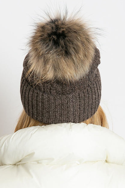 Elegant winter hat from AT with a stylish wide cuff and soft fluffy pompom, made of 50% acrylic, 30% cotton, and 20% cashmere.