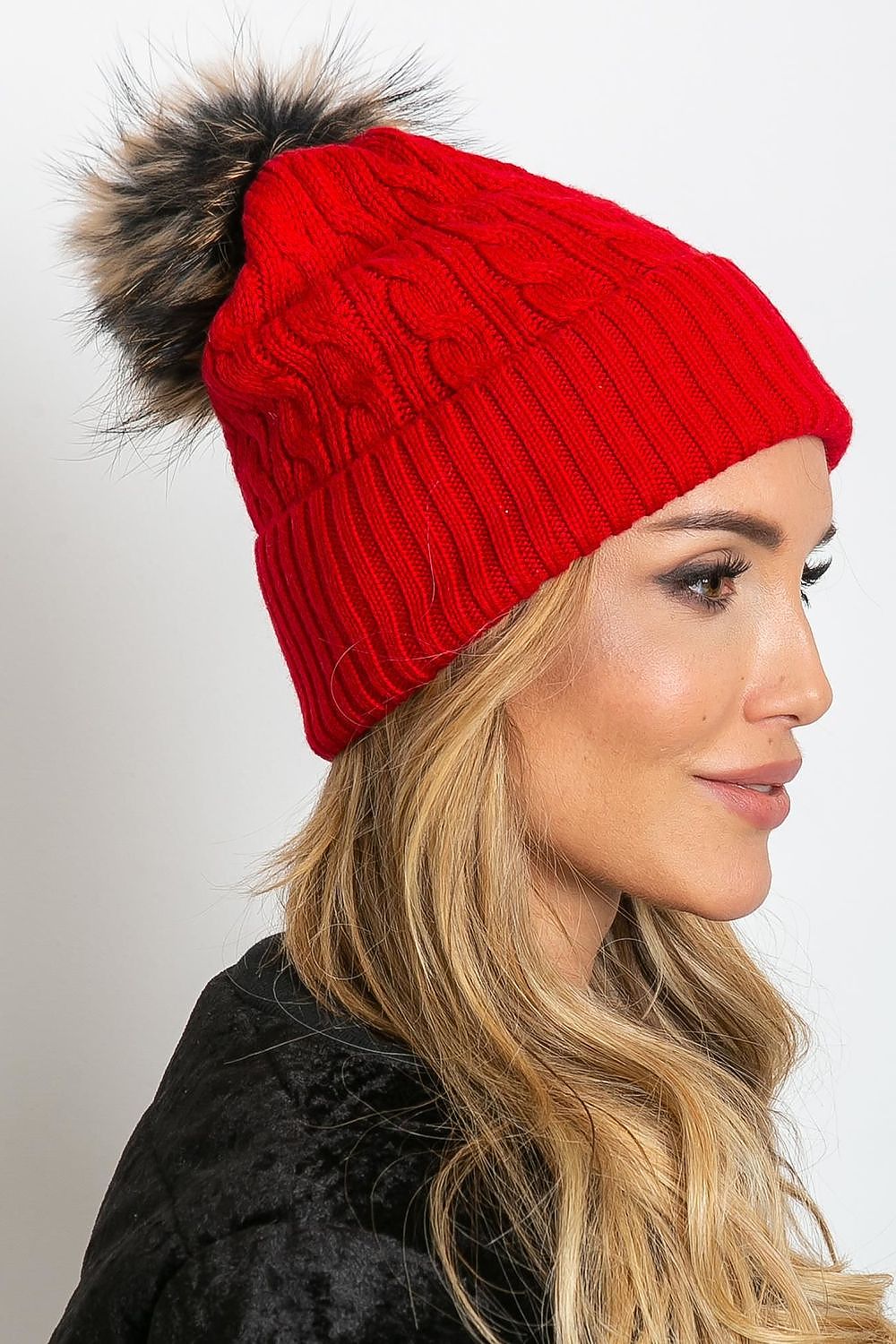 Luxury winter cap by AT featuring a wide cuff and fluffy pompom made from 50% acrylic, 30% cotton, and 20% cashmere.