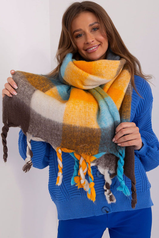 Luxurious long plaid scarf with fringes by AT, showcasing vibrant colours ideal for stylish fall-winter layering.
