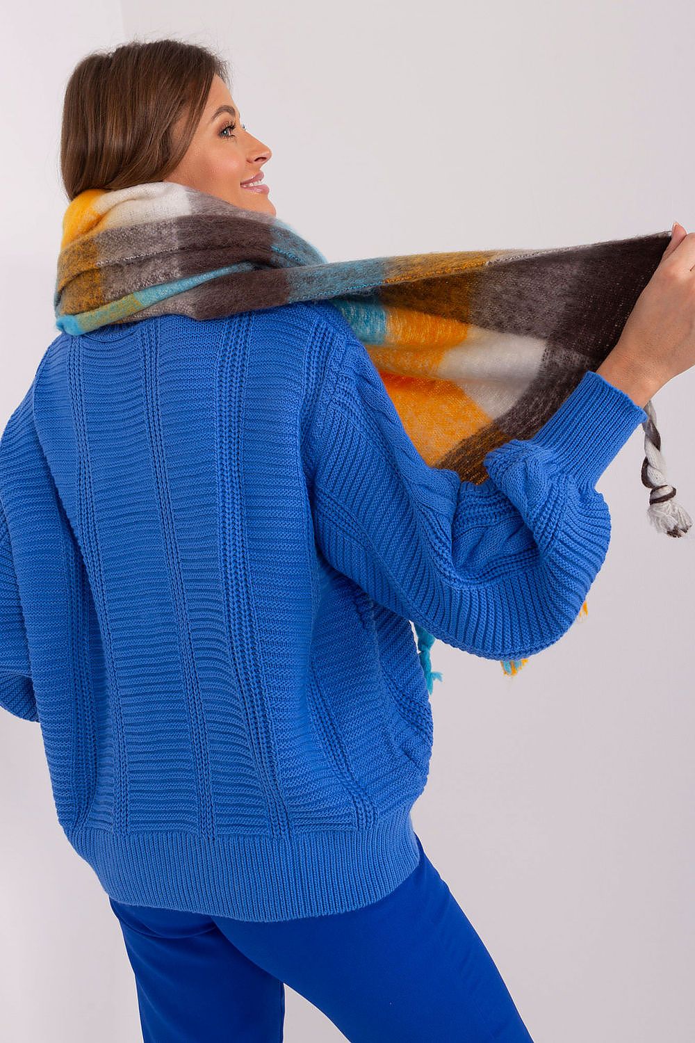 Elegantly styled long plaid scarf with fringes by AT, made from 100% polyester for warmth and versatility in fall-winter fashion.