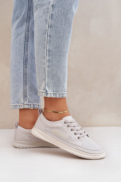 Luxury breathable leather sneakers for men and women by Step in Style, showcasing a classic low-top design with natural leather construction and perforations for comfort, ideal for everyday wear.