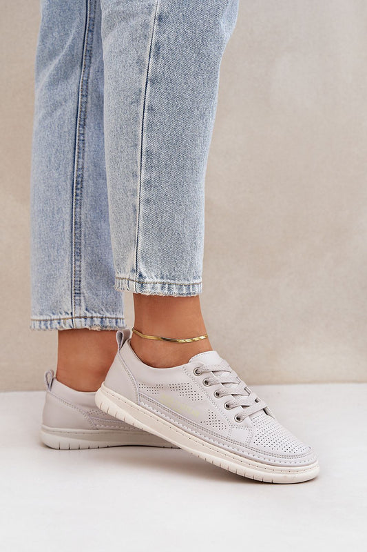 Luxury breathable leather sneakers for men and women by Step in Style, showcasing a classic low-top design with natural leather construction and perforations for comfort, ideal for everyday wear.