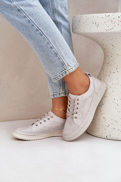 Elegant and fashionable low-top leather sneakers for everyday wear, designed by Step in Style, showcasing comfort with perforated breathable leather.