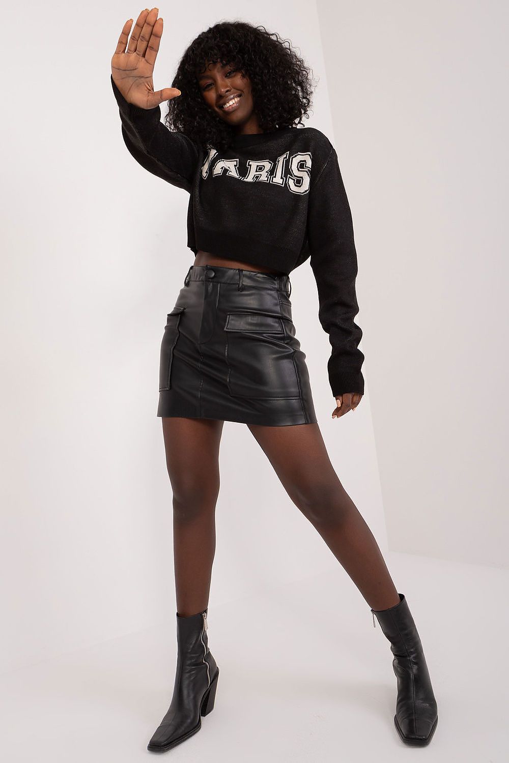 Soft acrylic and wool blend Badu short women's jumper, featuring stylish long sleeves and modern front writing, ideal for pairing with jeans or skirts.