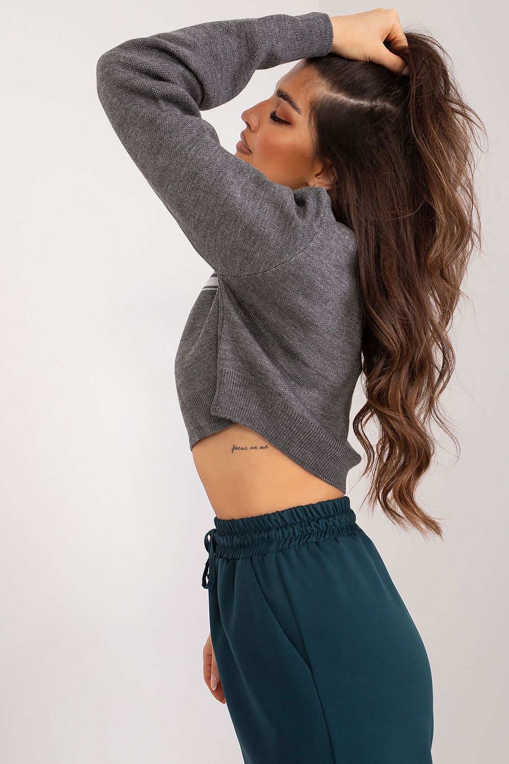 Chic Badu women's sweater styled with high-waisted pants or skirts, crafted from a quality acrylic-wool mix that ensures comfort and style.