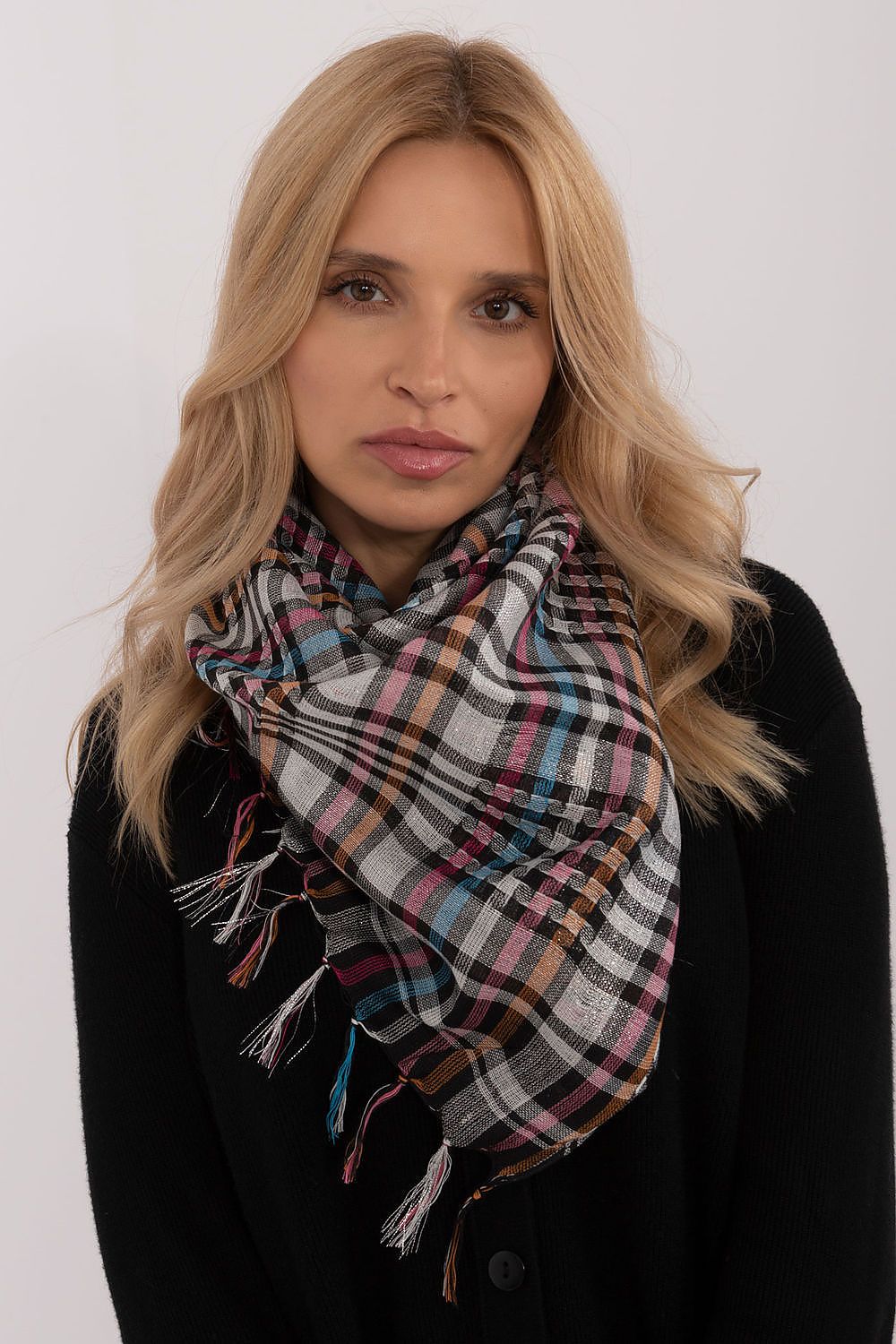 Chic close-up of the AT checkered neckerchief scarf showcasing the intricate decorative fringes and luxurious fabric blend ideal for everyday elegance.