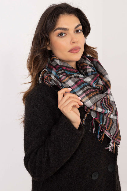 AT's luxurious checkered scarf displayed as a versatile accessory, showcasing its large size and classic design for any occasion.