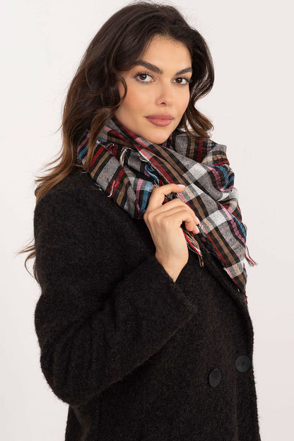 Soft polyester and viscose blend scarf by AT, showcasing a stylish checkered design ideal for comfort and protection against the cold.