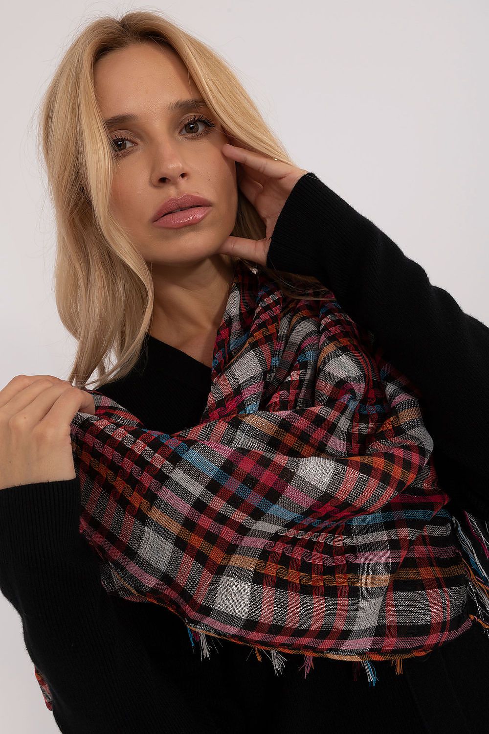 Luxurious checkered scarf by AT, with a classic design and plush material, ideal for adding elegance to any ensemble.