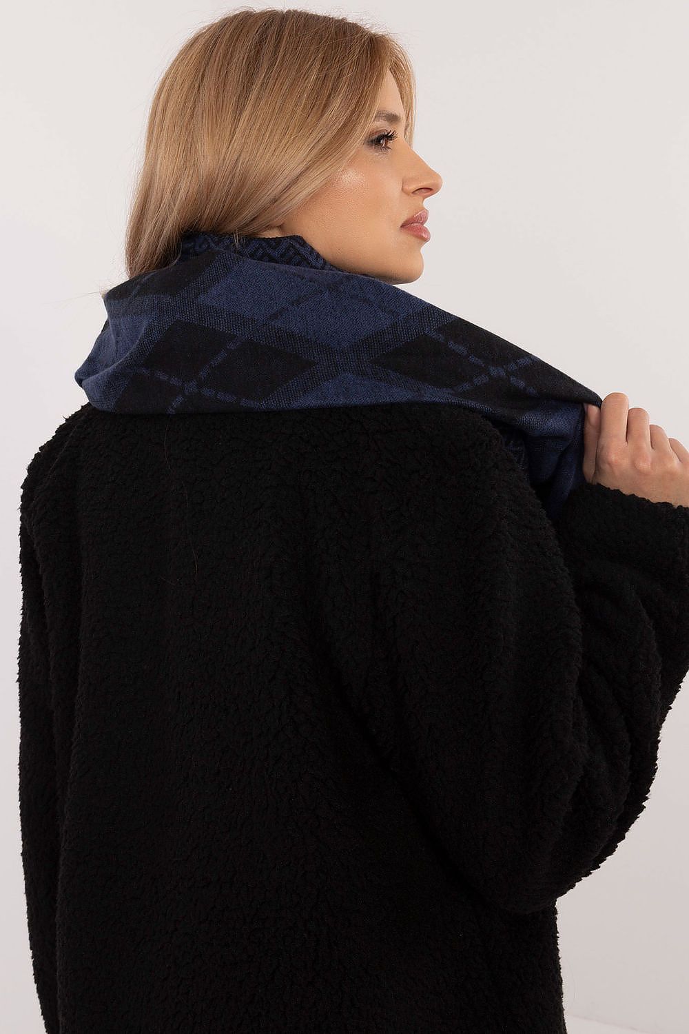 High-quality geometric patterned viscose scarf by AT, elegantly draped to showcase its versatility as a fashion accessory.