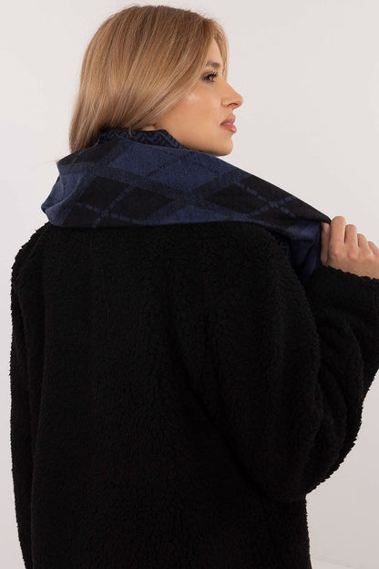 High-quality geometric patterned viscose scarf by AT, elegantly draped to showcase its versatility as a fashion accessory.