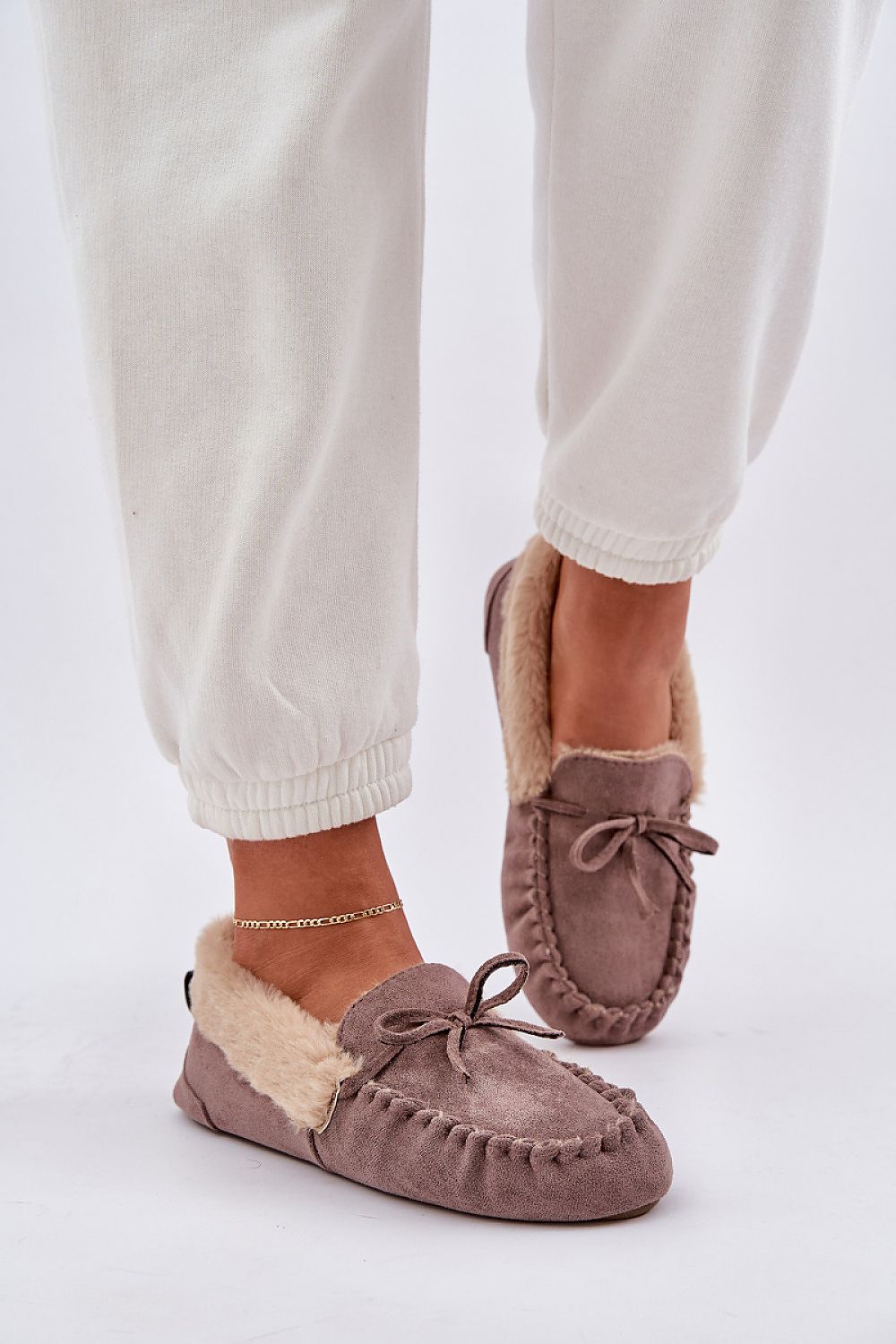 Close-up of Step in style eco suede moccasin slippers, featuring plush fur lining and elegant craftsmanship.