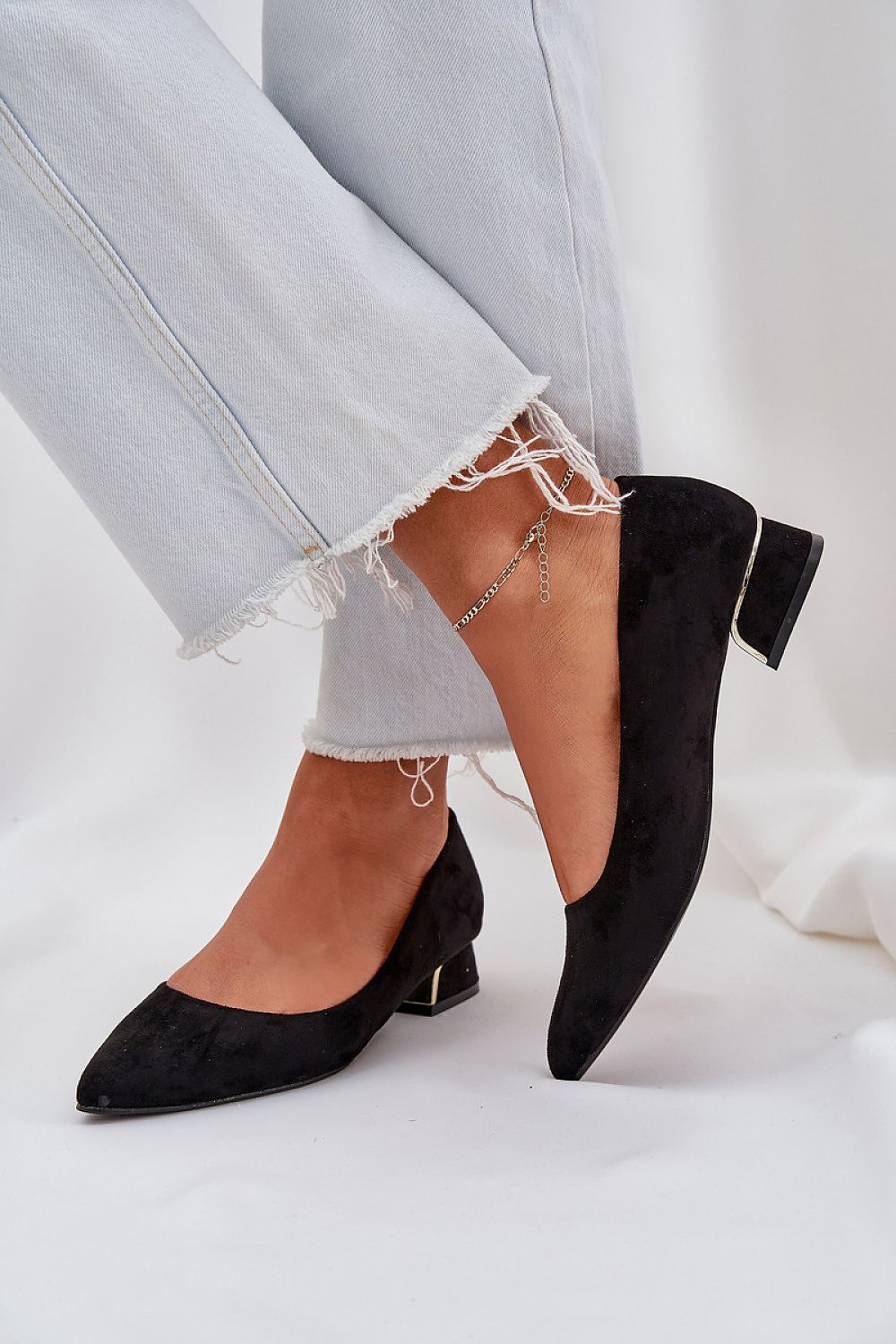 Step in Style's sophisticated eco suede low-heeled pumps, combining classic elegance with a contemporary gold detail, available in sizes EU 36-41.