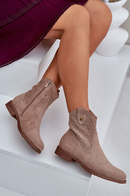 Side view of Step in Style's eco suede boots featuring intricate lace design and functional zipper for easy wear.