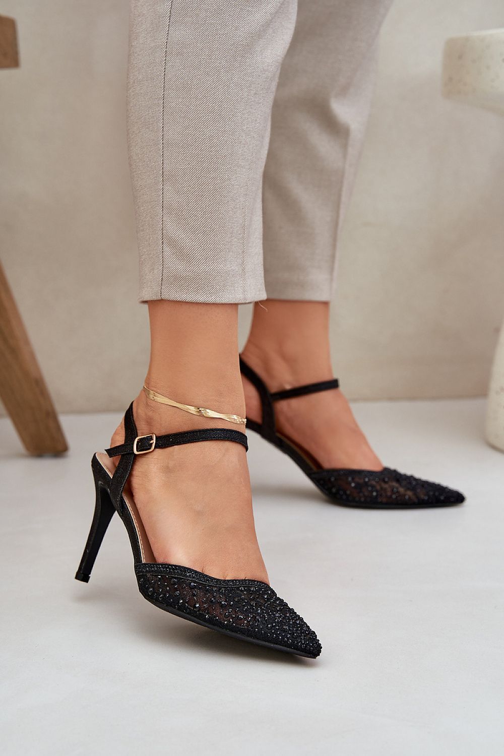 Elegant shiny high heels with adjustable strap by Step in Style, perfect for evening outings and special occasions, showcasing a refined look with pointed toes and subtle decorations.