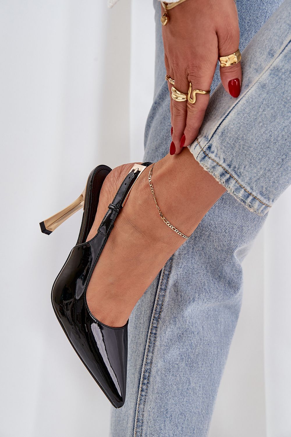 Chic pointed toe patent leather stilettos with adjustable buckle strap by Step in Style, perfect for evening occasions.