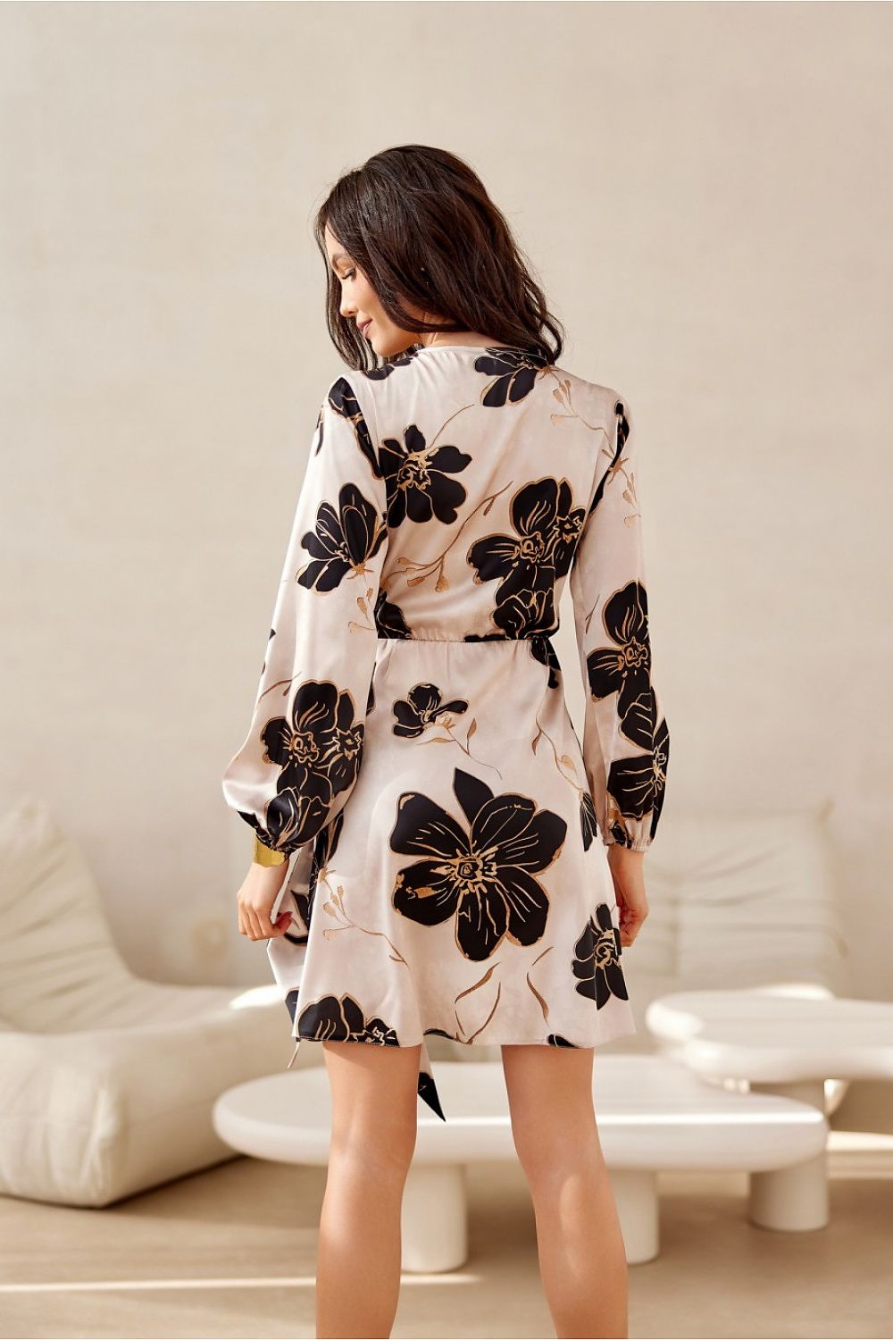 Elegant luxurious mini dress by Roco Fashion featuring long sleeves and a flattering wrap top design.