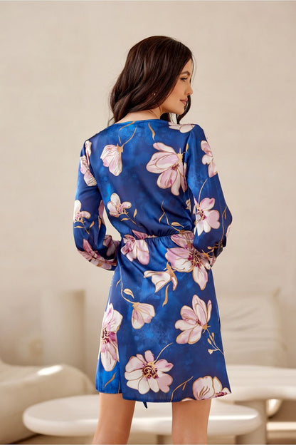 Model showcasing the sophisticated mini dress with long sleeves from Roco Fashion at a chic event.