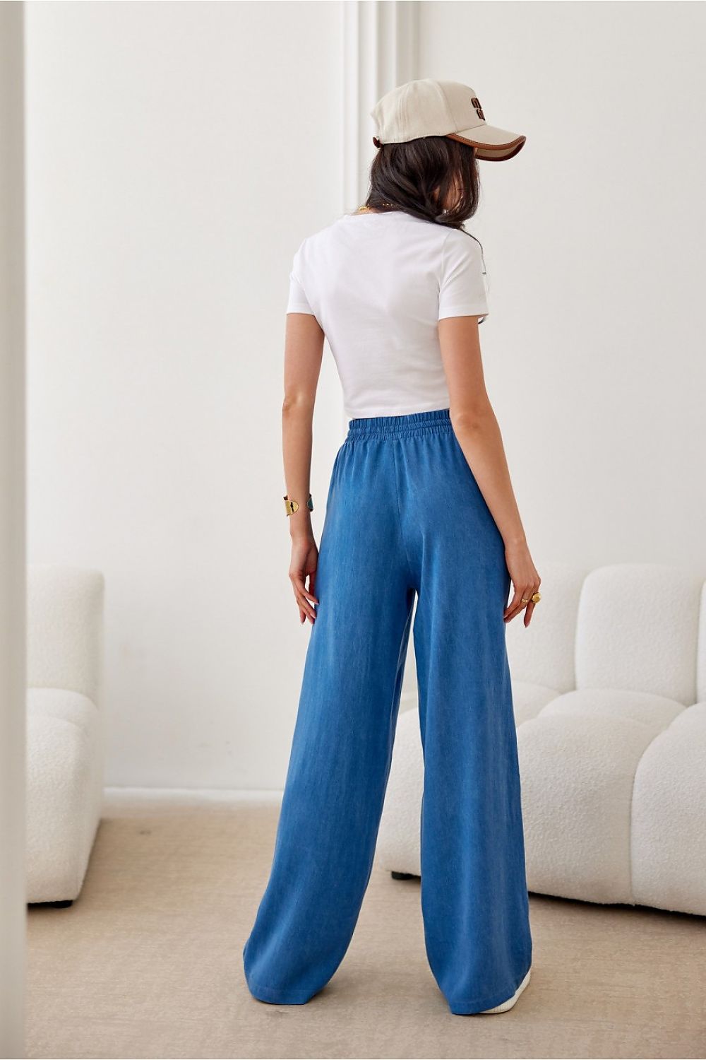 Stylish Roco Fashion women's trousers showcasing a tied top high waist and breathable fabric, designed for comfort and elegance.