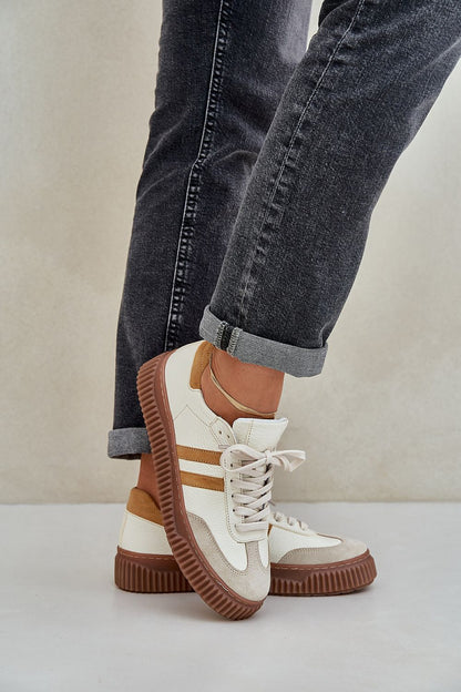 Close-up view of Step in Style luxury women's natural leather sneakers showcasing premium leather texture and intricate lace-up detailing.