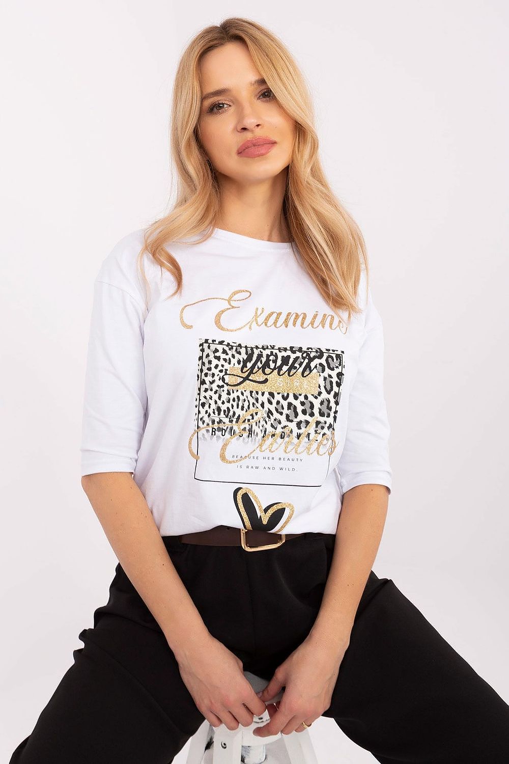 Close-up view of animal print details on a fashionable blouse, made from soft cotton blend by Factory Price for comfort and elegance.