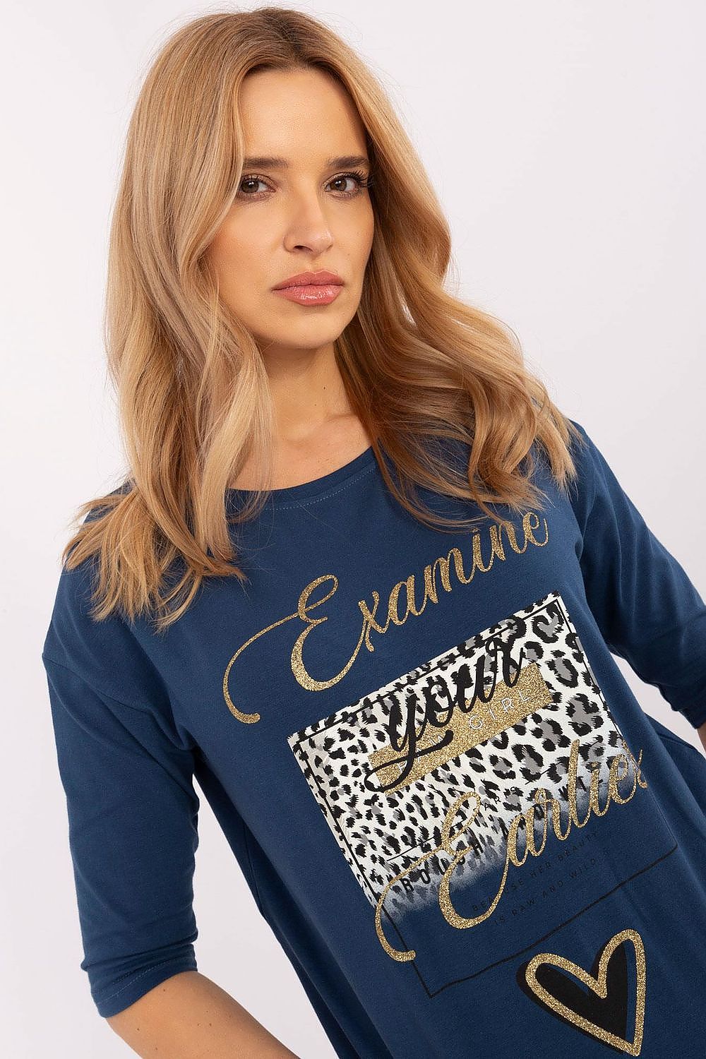 Model showcasing luxury cotton blend blouse by Factory Price, featuring a trendy 3/4 sleeve and eye-catching animal motifs.