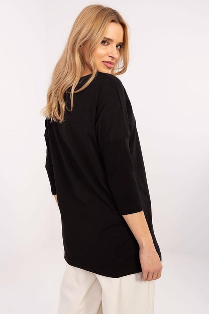 Close-up of the round neckline and longer length of the blouse from Factory Price, highlighting sophistication and style.