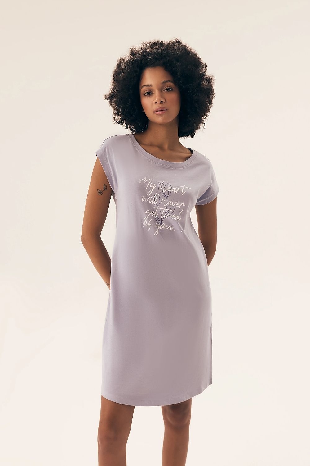 Elegantly styled Henderson Women's Cotton Nightshirt displayed in a luxurious setting, featuring a soft, knee-length design and delicate print, perfect for adding sophistication to nightwear.