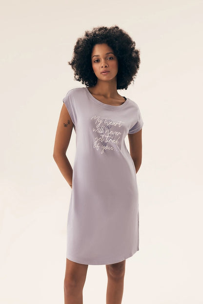 Elegantly styled Henderson Women's Cotton Nightshirt displayed in a luxurious setting, featuring a soft, knee-length design and delicate print, perfect for adding sophistication to nightwear.