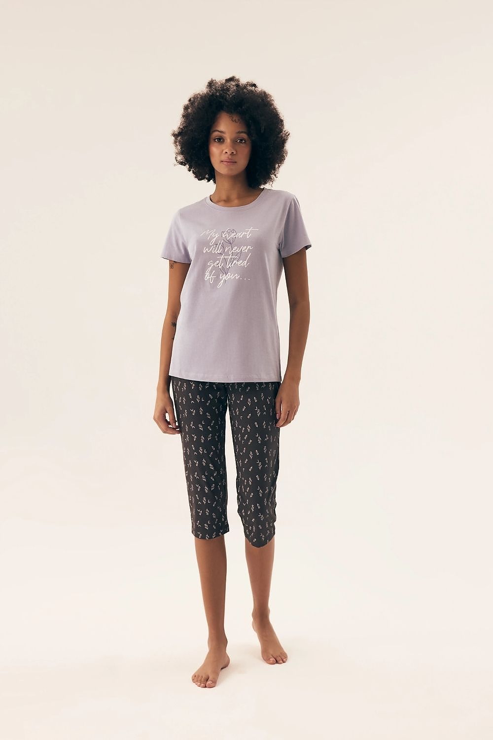 Luxurious Henderson cotton women's pajamas set featuring a stylish short-sleeve blouse and elegant 3/4 pants, perfect for relaxation and comfort at home.