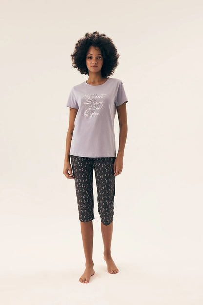 Luxurious Henderson cotton women's pajamas set featuring a stylish short-sleeve blouse and elegant 3/4 pants, perfect for relaxation and comfort at home.