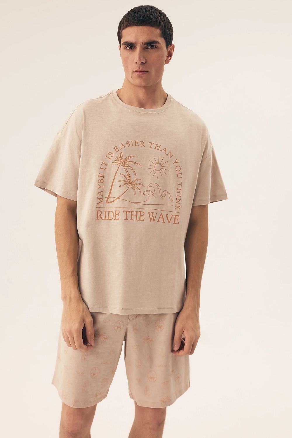 Luxurious Henderson Men's Cotton Pyjamas Set featuring a stylish short-sleeved tee and knee-length shorts, designed for comfort and modern style in sizes M-XXL. Perfect nightwear for warm evenings.