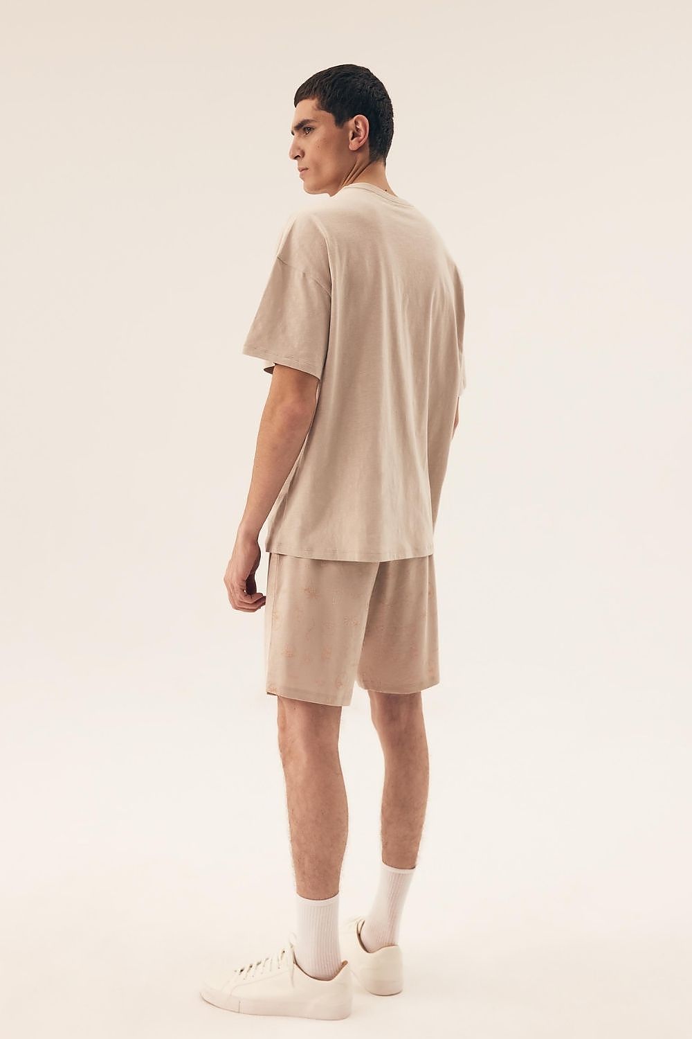 Luxurious Henderson Men's Cotton Pyjamas Set featuring a short-sleeved tee and knee-length shorts, elegantly designed for comfort and style, ideal for warm nights.