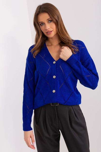 Model wearing Rue Paris elegant women's cardigan in EU size 0, demonstrating its versatile styling options and classic charm for everyday elegance.