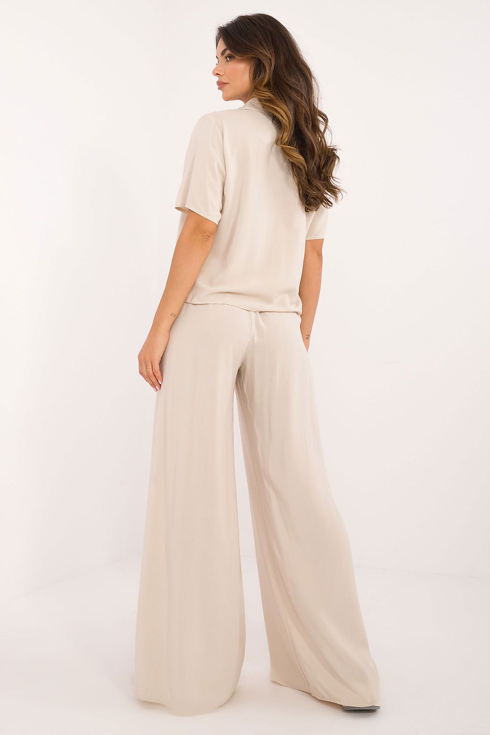 High waist trousers from Lakerta's stylish viscose set, showcasing wide legs and concealed side zipper for a chic silhouette and a sophisticated fit.
