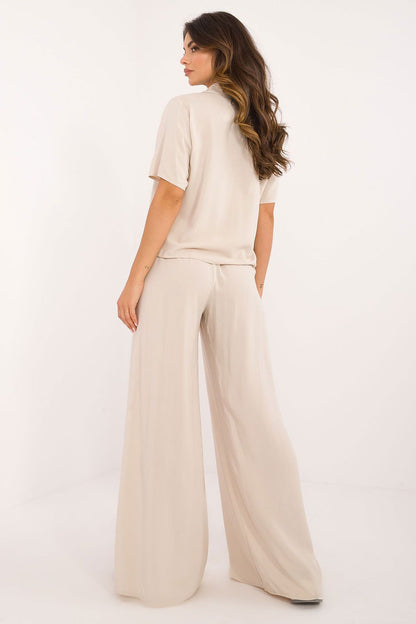 High waist trousers from Lakerta's stylish viscose set, showcasing wide legs and concealed side zipper for a chic silhouette and a sophisticated fit.
