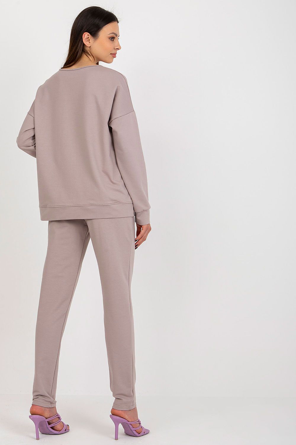Elegant and stylish women's tracksuit set, designed by Lakerta, showcasing a comfortable sweatshirt and high-waisted trousers perfect for casual outings or relaxing at home.