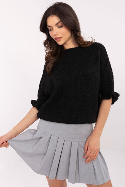 Luxurious round neckline of Italy Moda's women's sweater, highlighting the delicate ruffle details on 3/4 length sleeves.