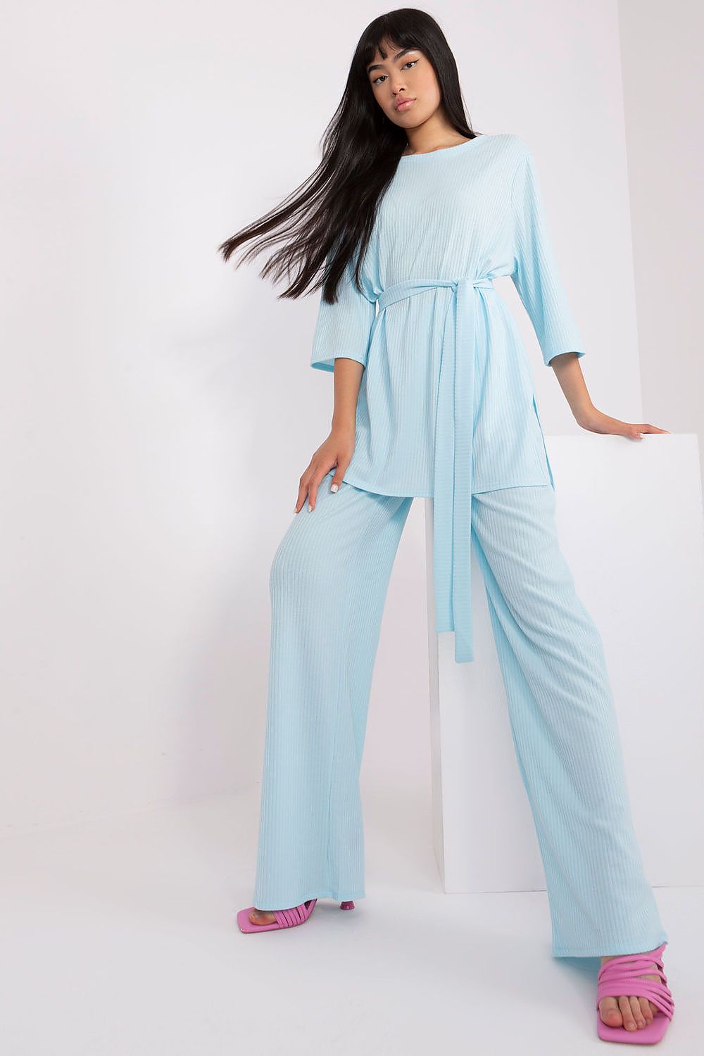 Close-up of Lakerta Women's Ribbed Fabric highlighting the luxurious texture and refined look of the stylish blouse and high-waisted pants set.