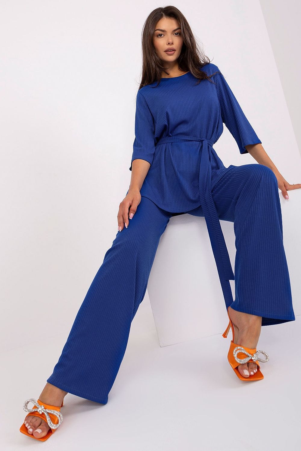 Model showcasing Lakerta Women's Ribbed Set S/M, an Elegant 3/4 Sleeve Blouse paired with High-Waisted Wide Pants, exuding contemporary luxury.