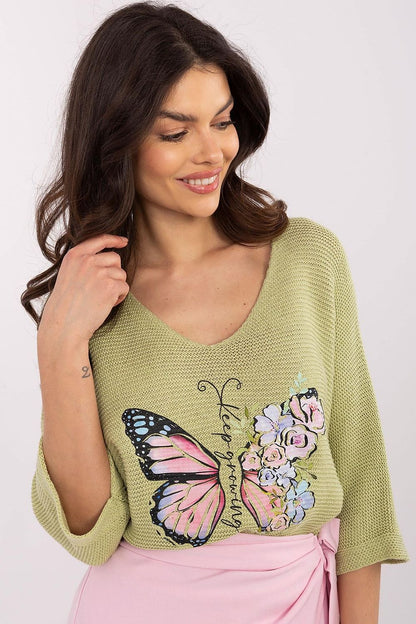 Close-up view of the butterfly print on the elegant women's sweater from Italy Moda, showcasing the intricate design and quality fabric of a cotton-acrylic blend.