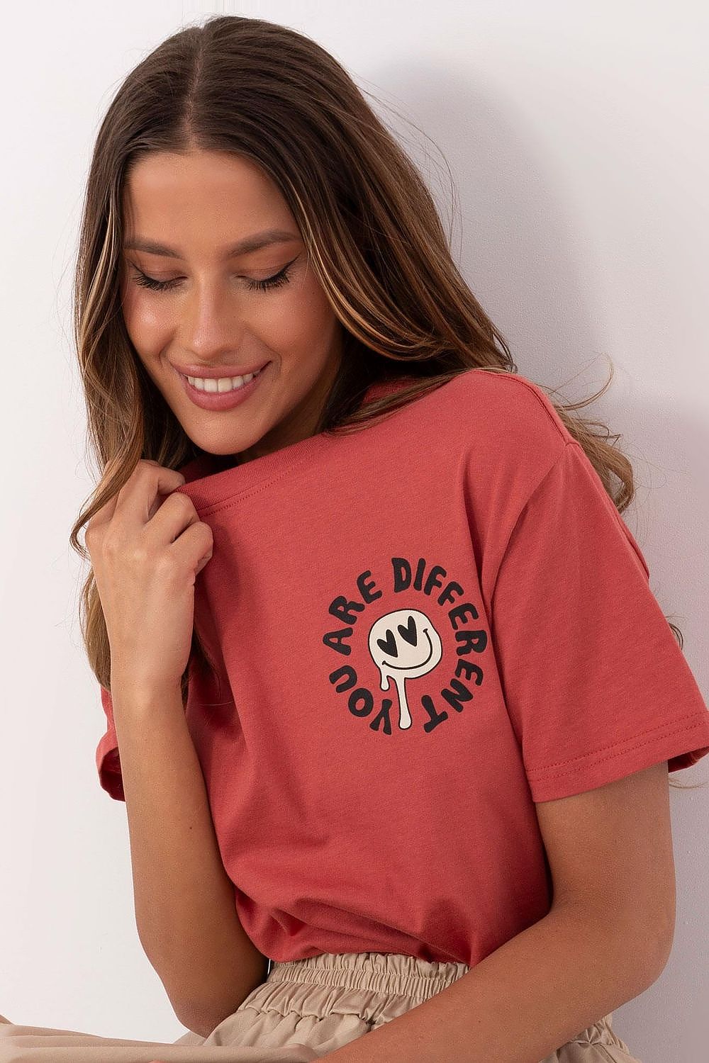 Elegant Sublevel women's t-shirt showcasing subtle front print and unique back design, perfect for stylish everyday wear.