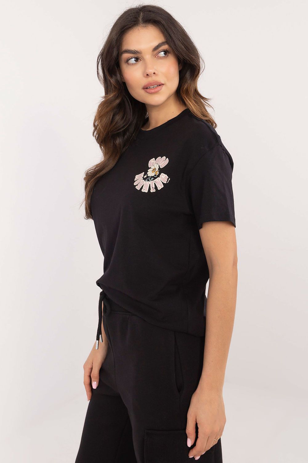 Close-up of Sublevel's luxury women's cotton t-shirt with subtle print, showcasing premium quality.