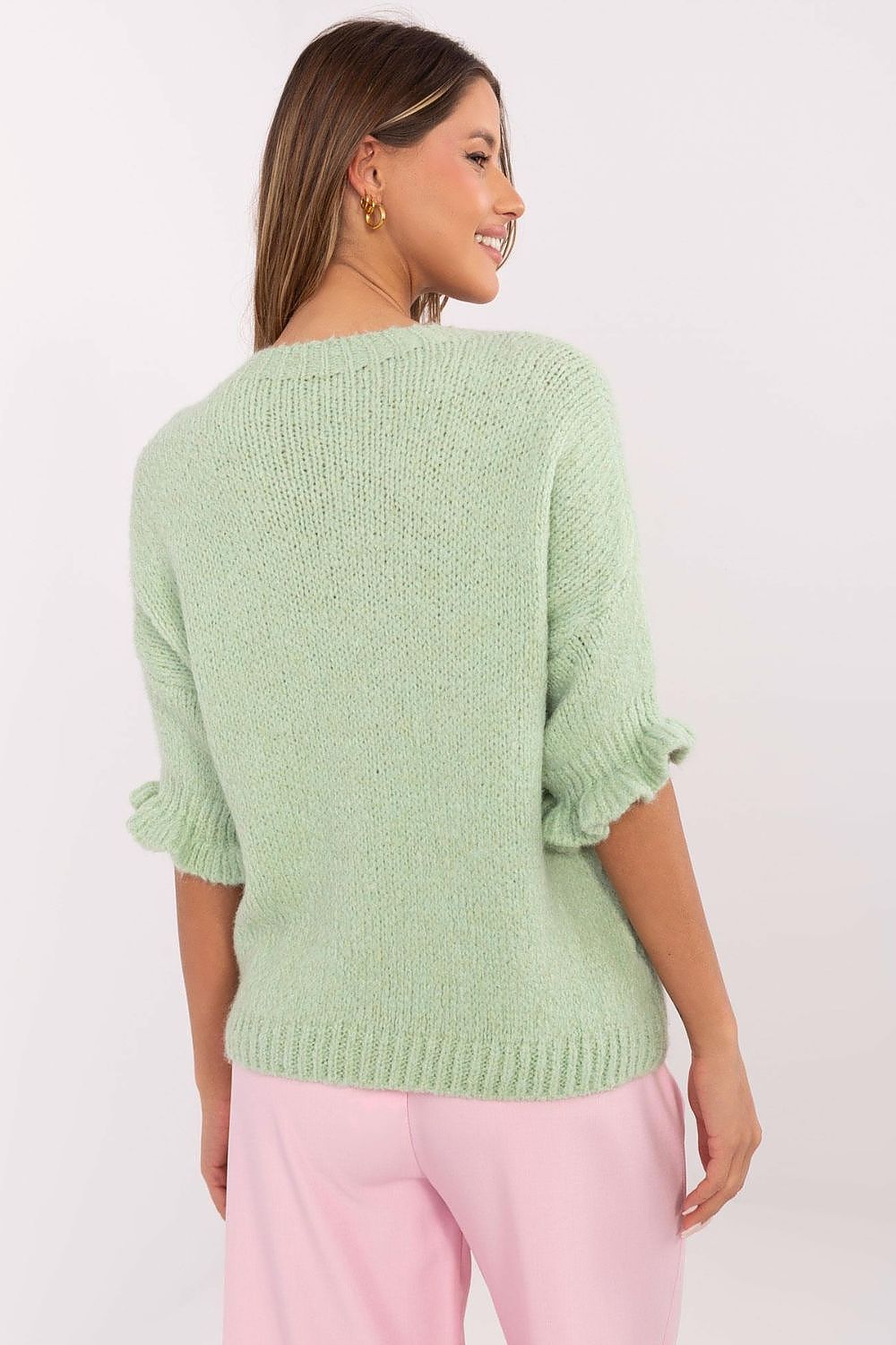 Close-up of the luxurious ruffle sleeve detail on the women's sweater from Italy Moda, showcasing the exquisite craftsmanship.