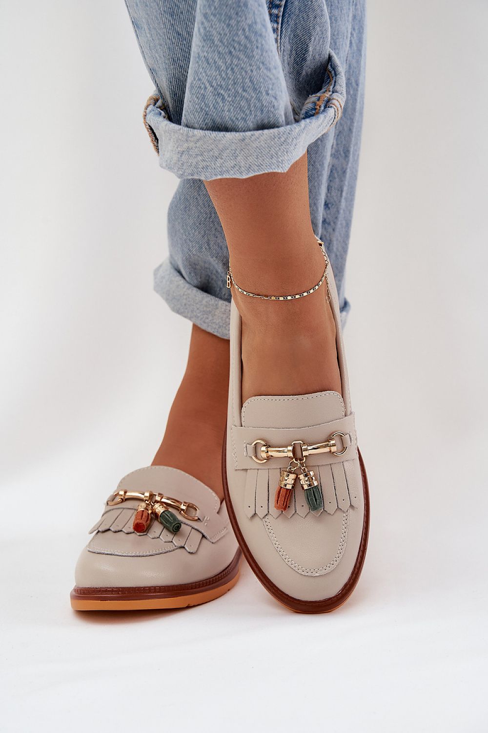 Step in style's chic moccasins crafted from premium natural leather, showcasing sophisticated elegance and comfort.